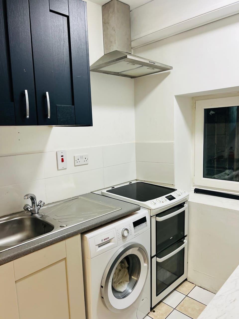 Kitchen or kitchenette, dishwasher, stove, washing machine, dryer