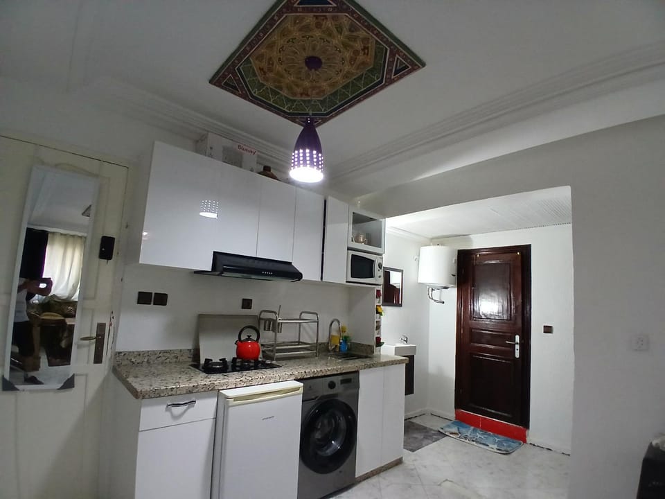 Kitchen or kitchenette, oven, stove, washing machine