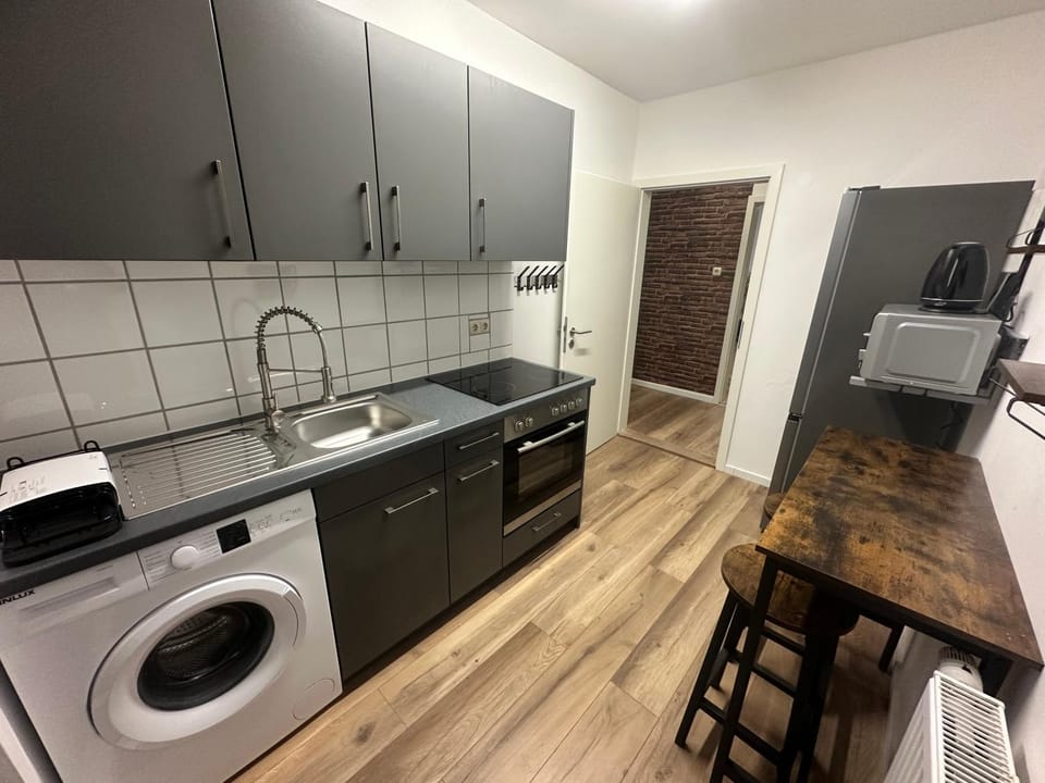 Kitchen or kitchenette, Dining area, Communal kitchen, Food, microwave, stove, washing machine, kitchen