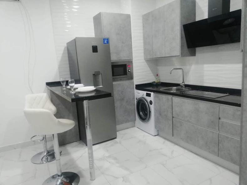 Kitchen or kitchenette, washing machine