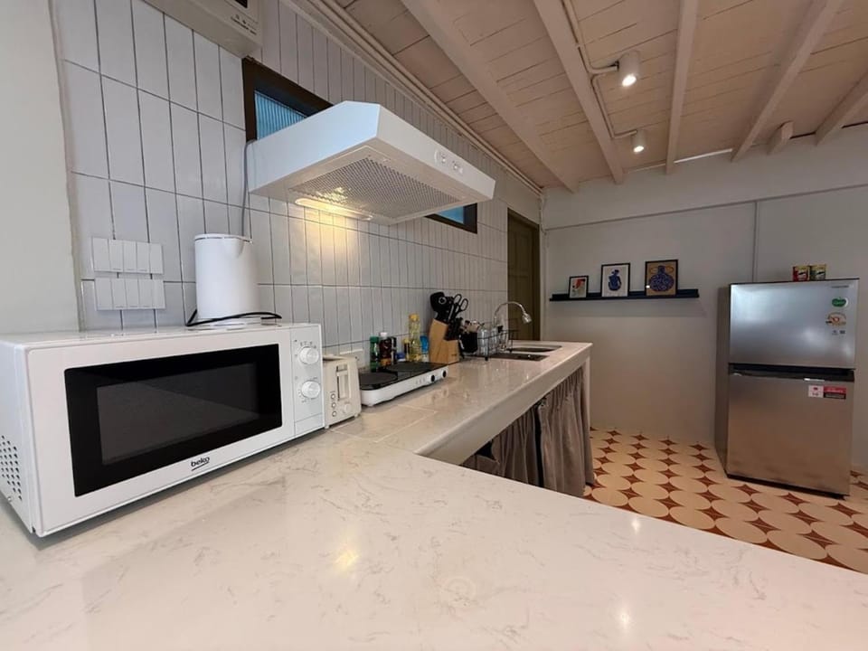 Kitchen or kitchenette, stove, toaster