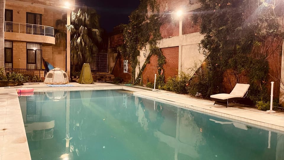 Property building, Night, Natural landscape, Pool view, Swimming pool, sunbed