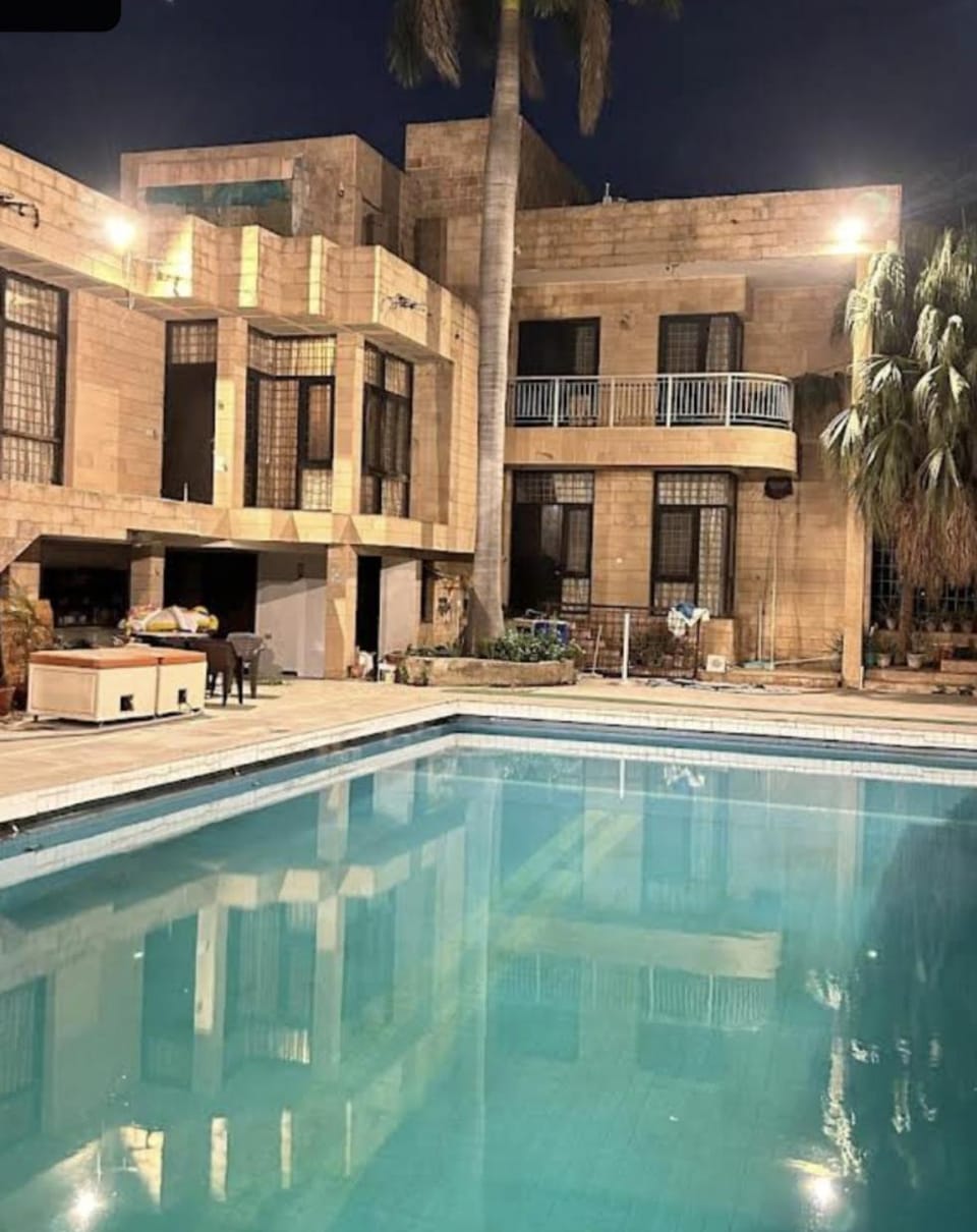 Property building, Night, Pool view, Swimming pool, sunbed