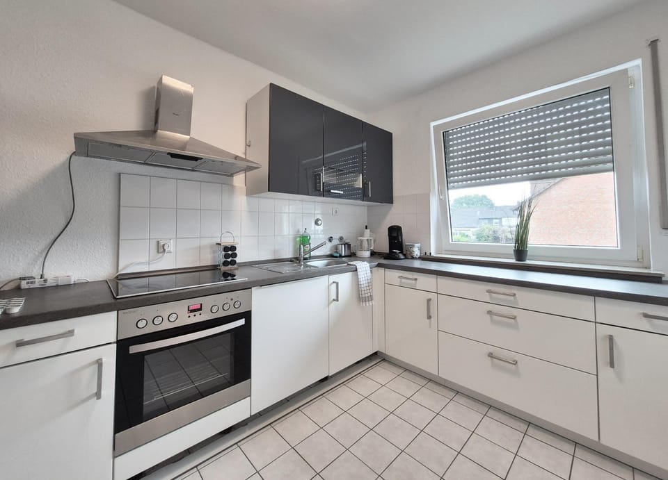 Kitchen or kitchenette, dishwasher, oven, stove