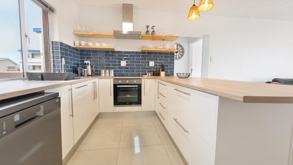 Kitchen or kitchenette, dishwasher, stove, toaster