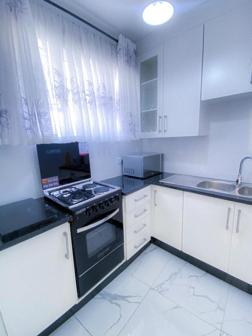 Kitchen or kitchenette, oven, stove