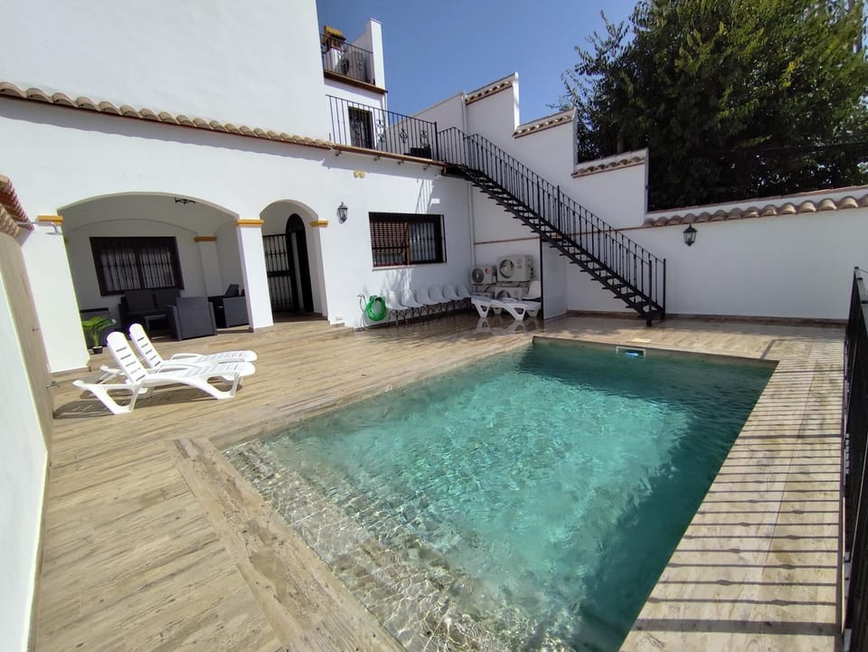 Property building, Patio, Day, Pool view, Swimming pool, sunbed