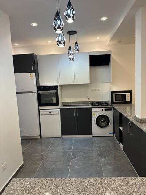 Kitchen or kitchenette, dishwasher, minibar, oven, stove, toaster, washing machine, dryer