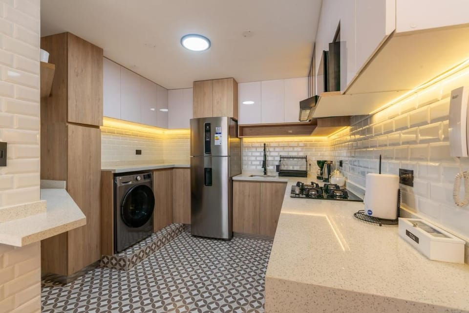 Kitchen or kitchenette, stove, washing machine, dryer