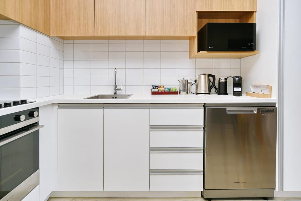 Kitchen or kitchenette, dishwasher, microwave, oven, stove