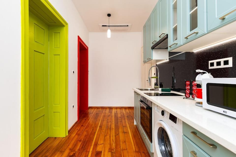 Kitchen or kitchenette, oven, stove, toaster, washing machine