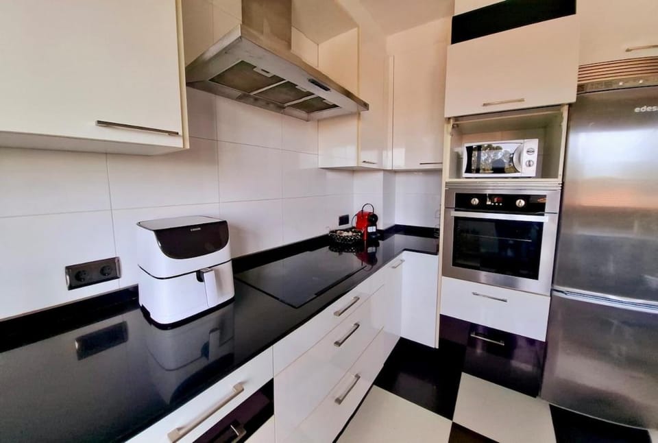 Kitchen or kitchenette, dishwasher, oven, stove, toaster
