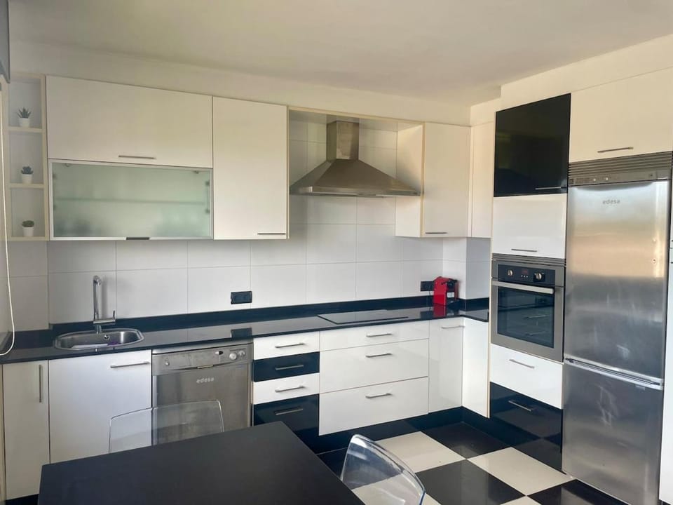 Kitchen or kitchenette, dishwasher, oven, stove, toaster