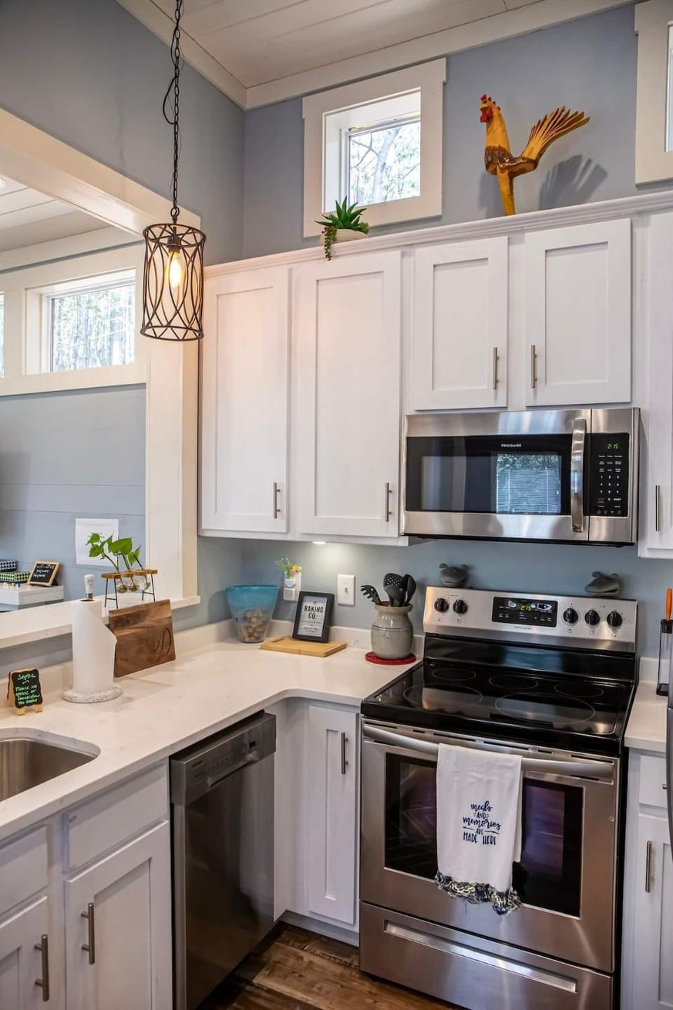 Kitchen or kitchenette, dishwasher, microwave, oven, stove