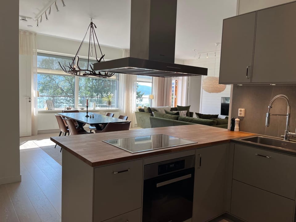 Living room, Lake view, dishwasher, stove, kitchen