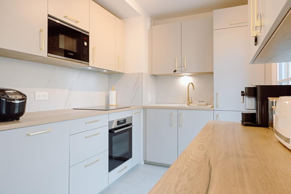 Kitchen or kitchenette, dishwasher, oven, stove