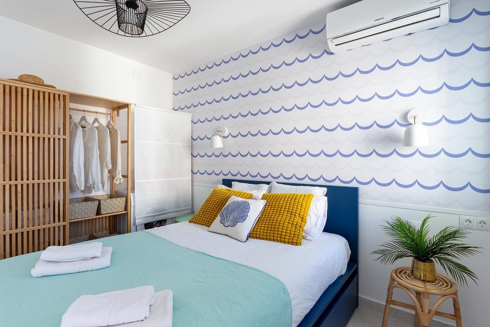 Bed, towels, wardrobe