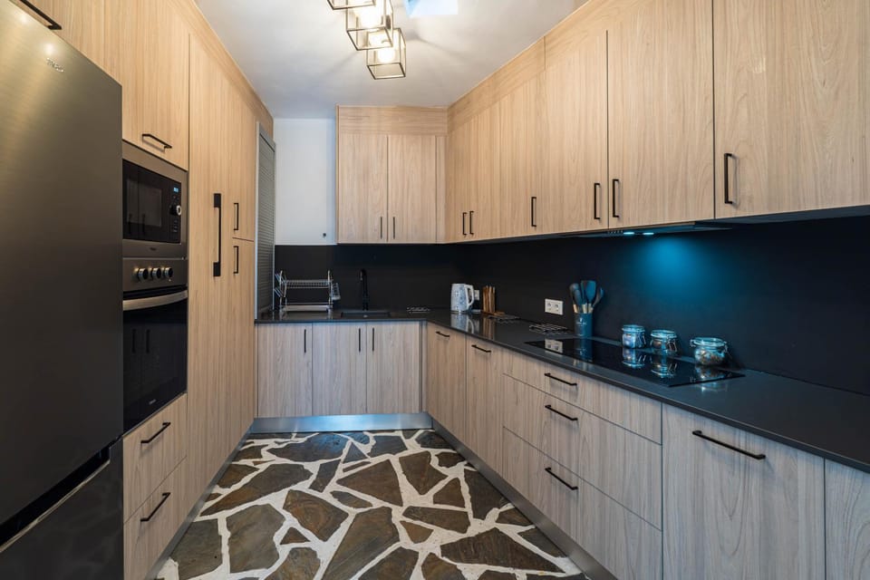 Kitchen or kitchenette, dishwasher, oven, stove
