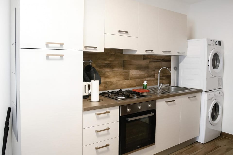 Kitchen or kitchenette, oven, stove, toaster, washing machine, dryer