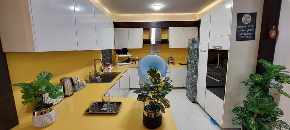Kitchen or kitchenette, dishwasher, microwave, oven, stove