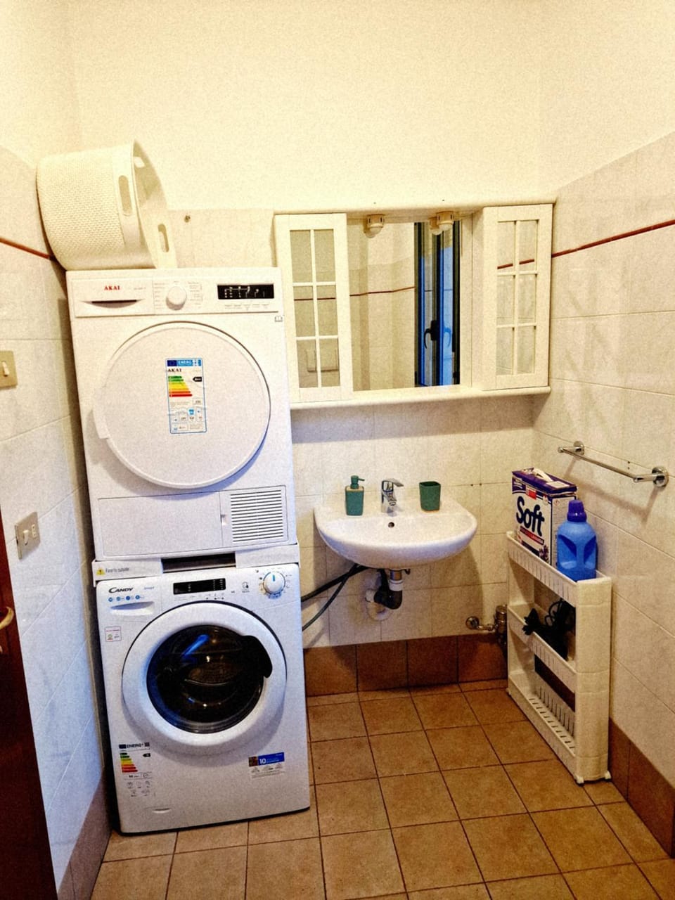 Bathroom, hair dryier, towels, washing machine, dryer
