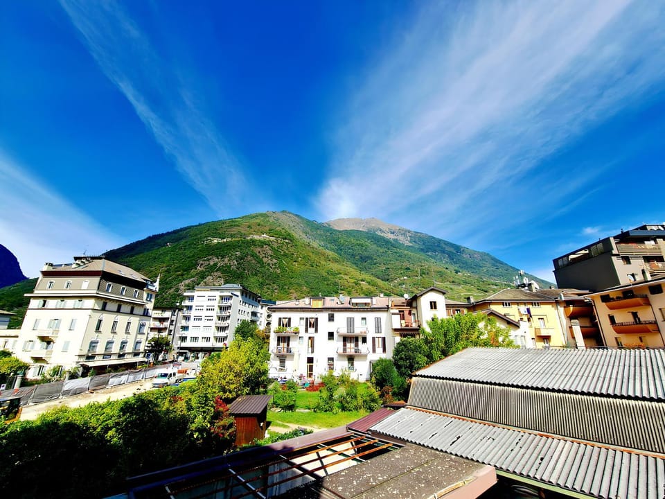 Property building, Nearby landmark, Day, Natural landscape, City view, Mountain view