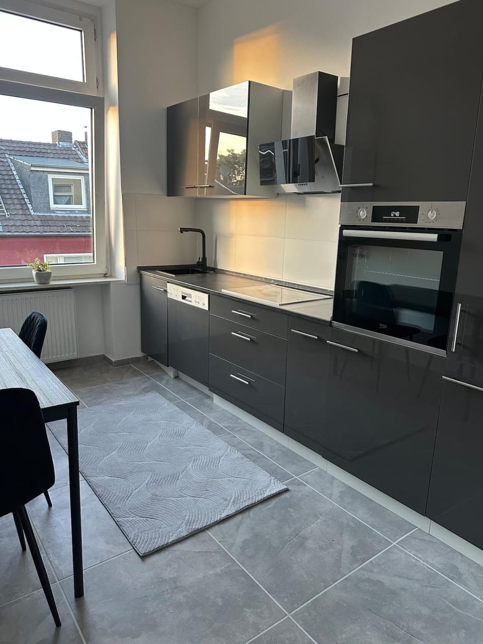 Kitchen or kitchenette, dishwasher, oven, stove