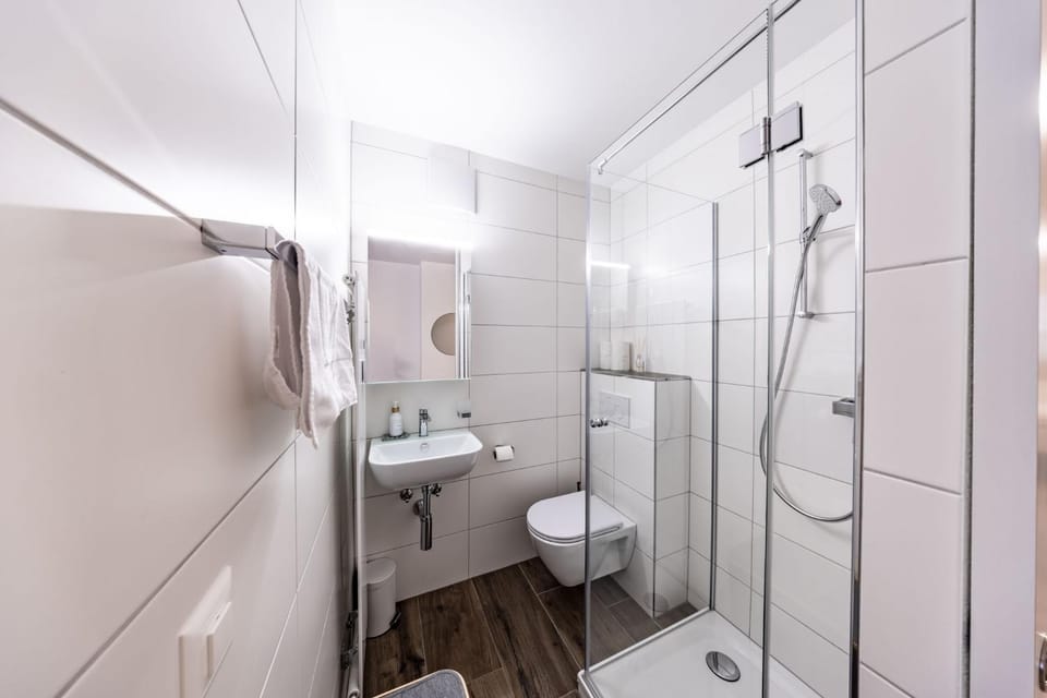 Shower, Toilet, Bathroom, hair dryier, towels