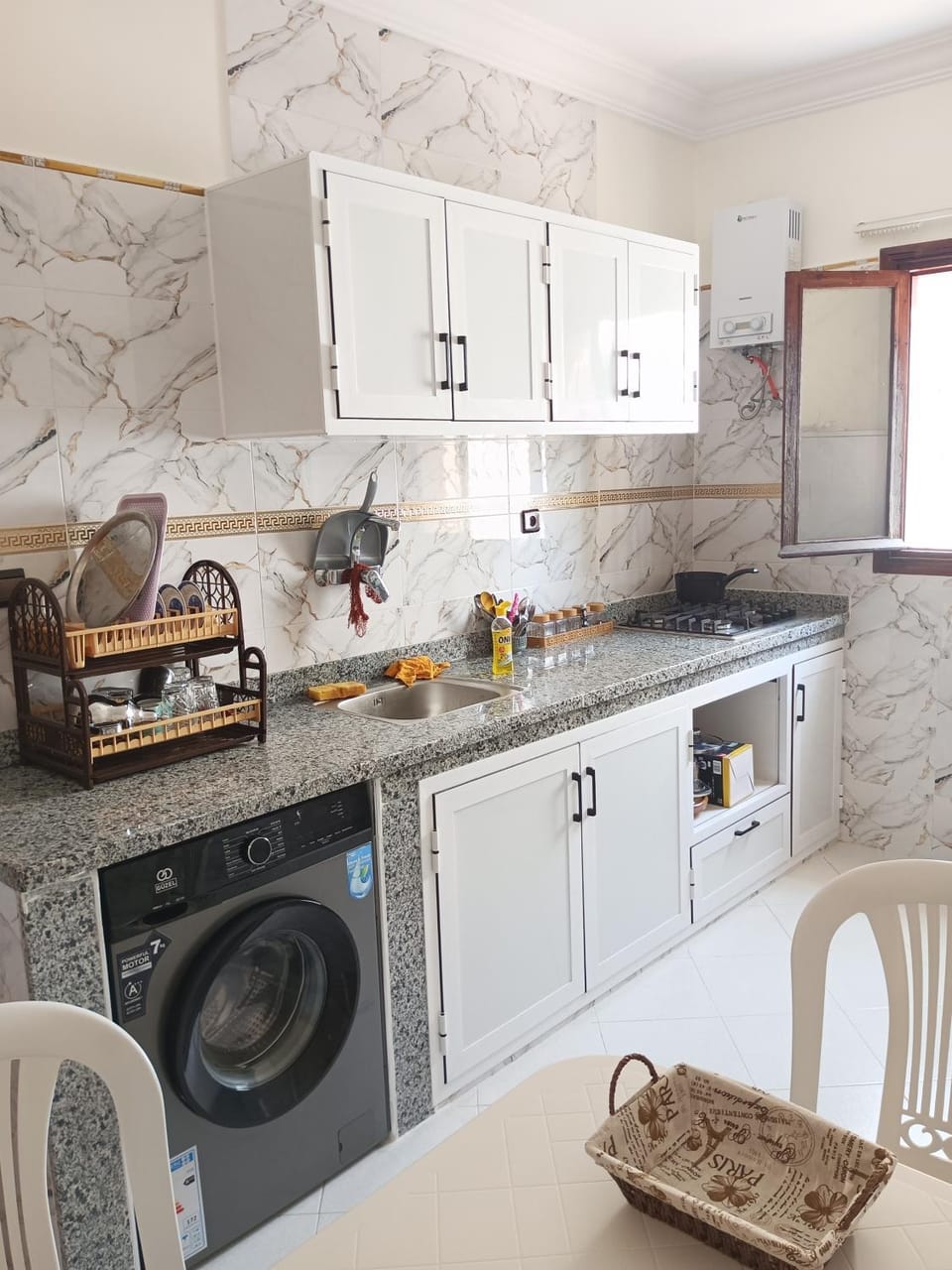 Kitchen or kitchenette, stove, washing machine, dryer
