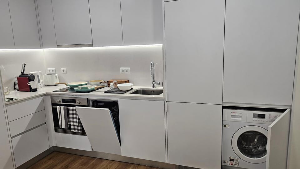 Kitchen or kitchenette, dishwasher, oven, stove, washing machine, dryer