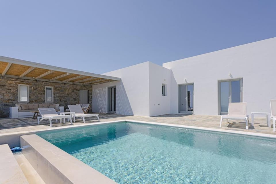 Property building, Patio, Pool view, Swimming pool, sunbed