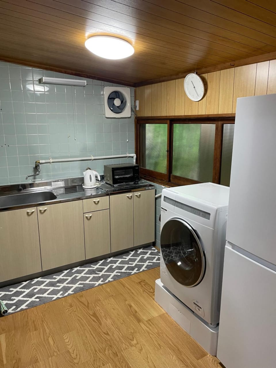Kitchen or kitchenette, dishwasher, stove, washing machine, dryer