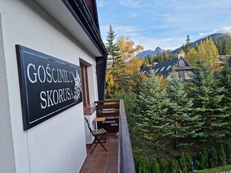 Property building, Day, Natural landscape, Logo/Certificate/Sign, Mountain view