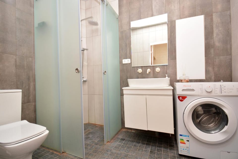 Shower, Toilet, Bathroom, towels, washing machine, dryer