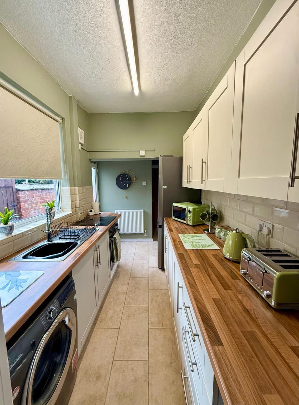 Kitchen or kitchenette, Kitchen or kitchenette, microwave, oven, stove, washing machine