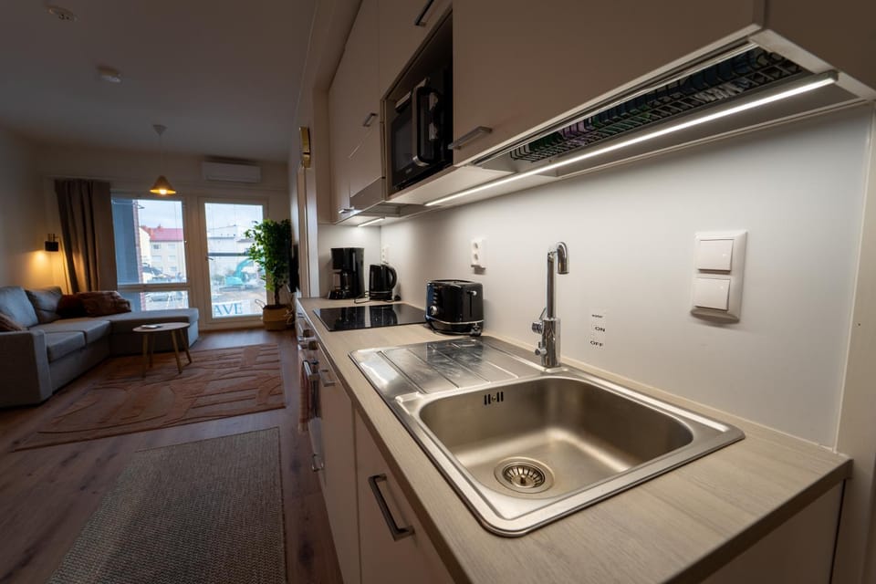 Living room, dishwasher, microwave, oven, stove, kitchen
