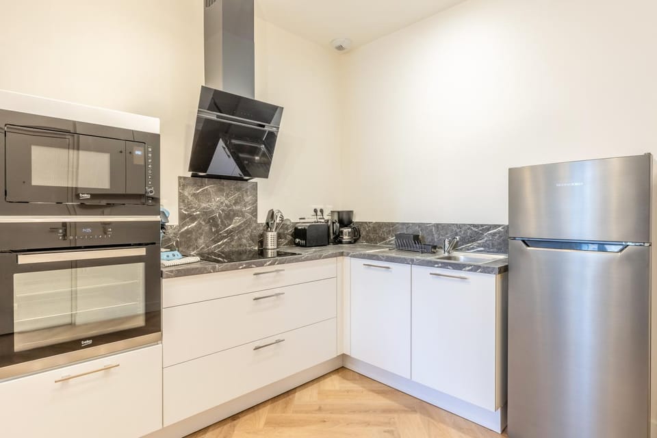 Kitchen or kitchenette, dishwasher, oven, stove, toaster
