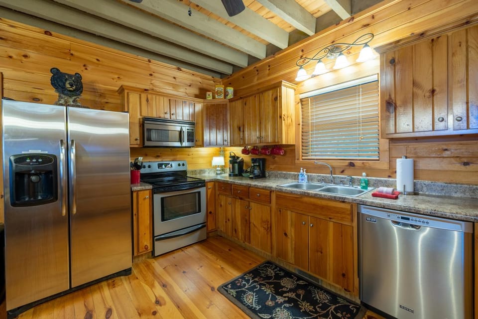 Kitchen or kitchenette, dishwasher, oven, stove