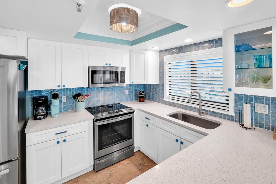 Updated direct oceanfront corner with a wrap-around balcony, heated pool and beach access House in Florida