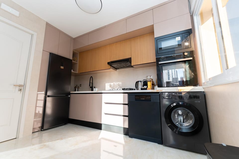 Kitchen or kitchenette, dishwasher, oven, stove, washing machine