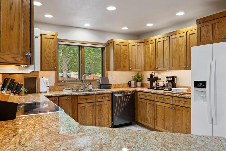 Kitchen or kitchenette, dishwasher, oven, stove