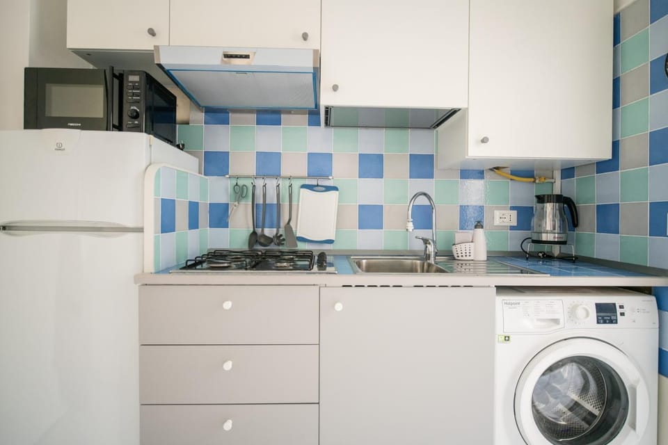 Kitchen or kitchenette, washing machine