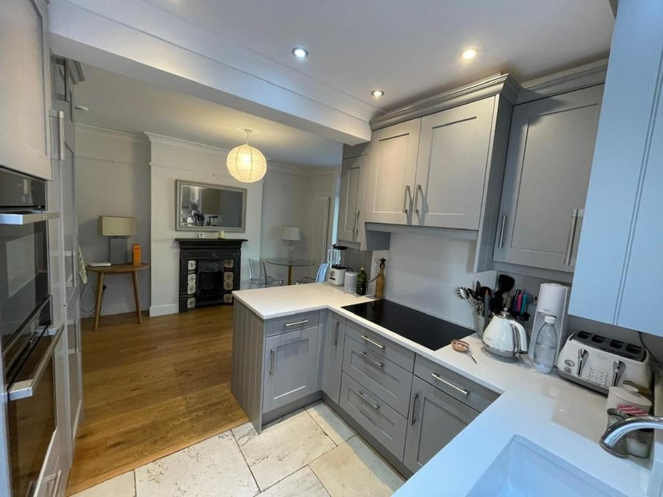 Kitchen or kitchenette, dishwasher, oven, stove, toaster