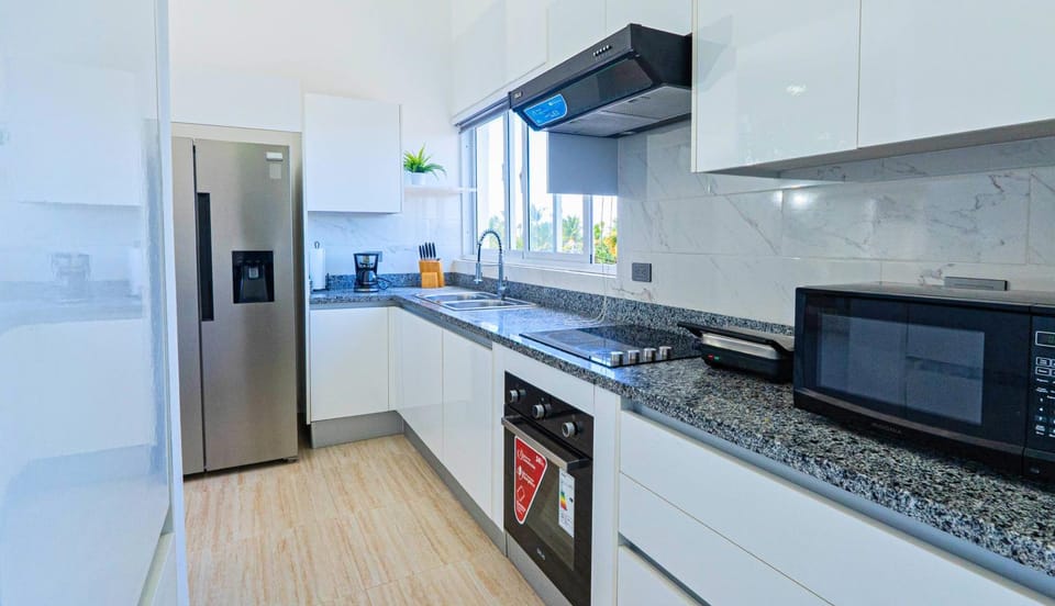 Kitchen or kitchenette, microwave, oven, stove, toaster
