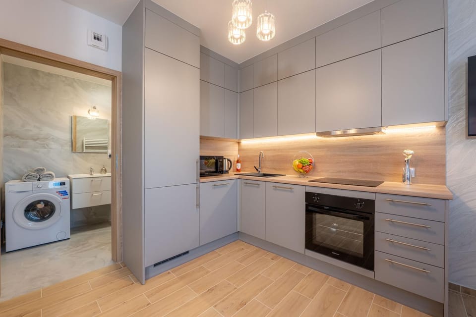 Kitchen or kitchenette, dishwasher, oven, stove