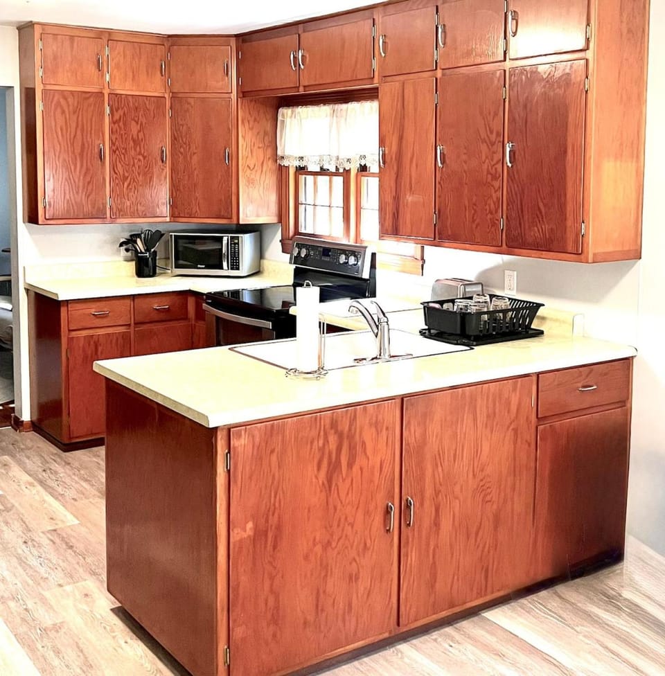 Kitchen or kitchenette, microwave, stove, toaster