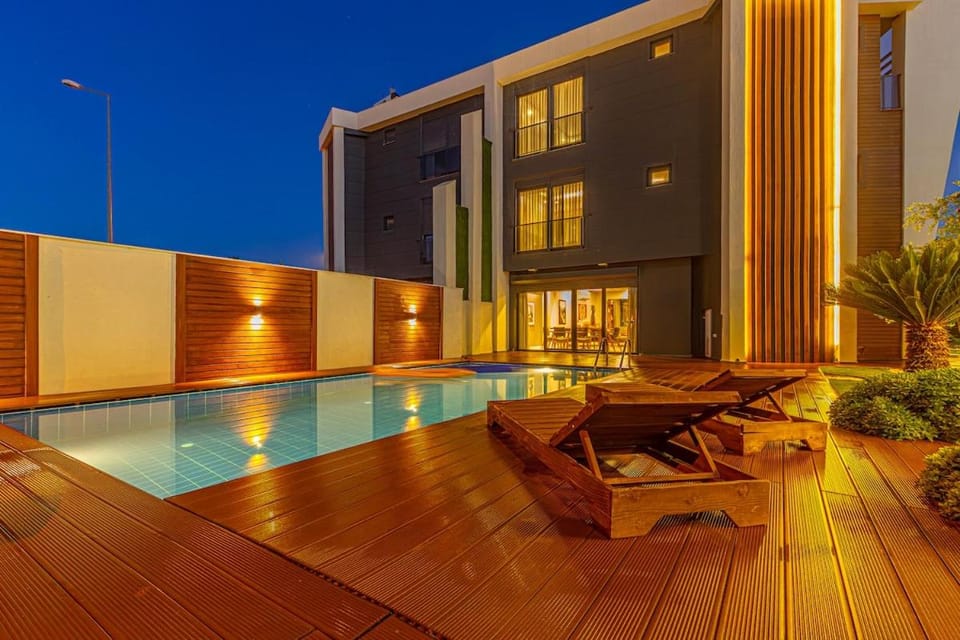Property building, Patio, Night, Pool view, Swimming pool, sunbed