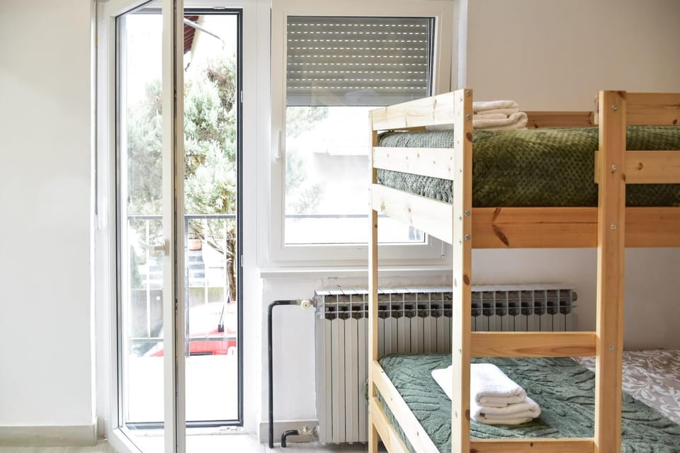 Bed, Photo of the whole room, Bedroom, bunk bed, towels, air conditioner
