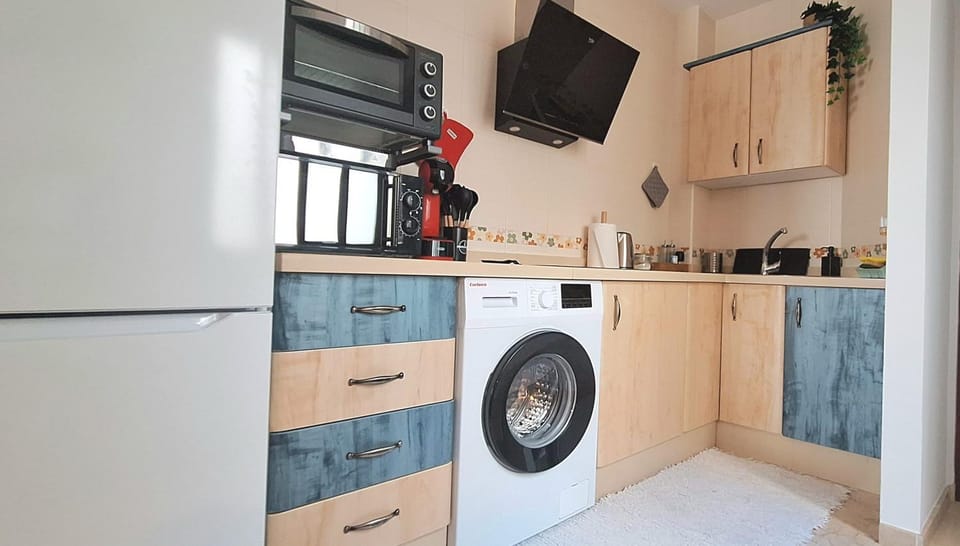 Kitchen or kitchenette, microwave, oven, washing machine
