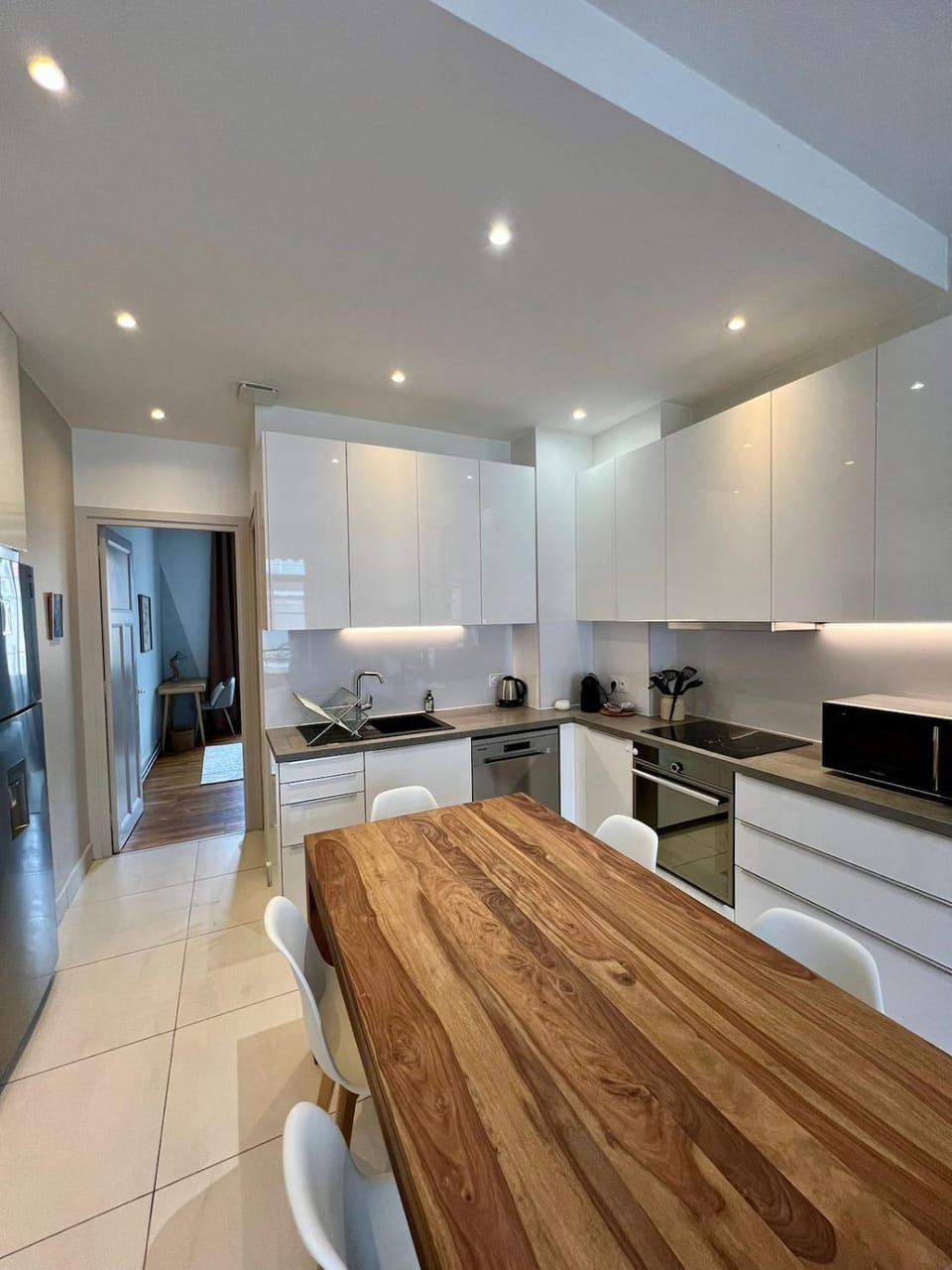 Kitchen or kitchenette, dishwasher, oven, stove